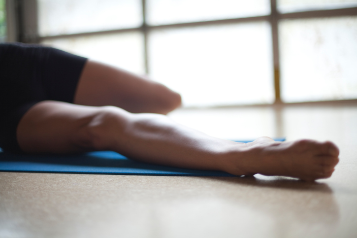 woman stretching legs