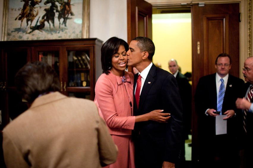 President Barack Obama kisses First Lady Michelle Obama after speaking about health care at a joint session of Congress, Sept. 9, 2009. (Official White House Photo by Pete Souza) This official White House photograph is being made available only for publication by news organizations and/or for personal use printing by the subject(s) of the photograph. The photograph may not be manipulated in any way and may not be used in commercial or political materials, advertisements, emails, products, or promotions that in any way suggests approval or endorsement of the President, the First Family, or the White House.