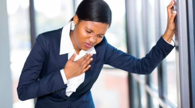 young african american businesswoman having heart attack