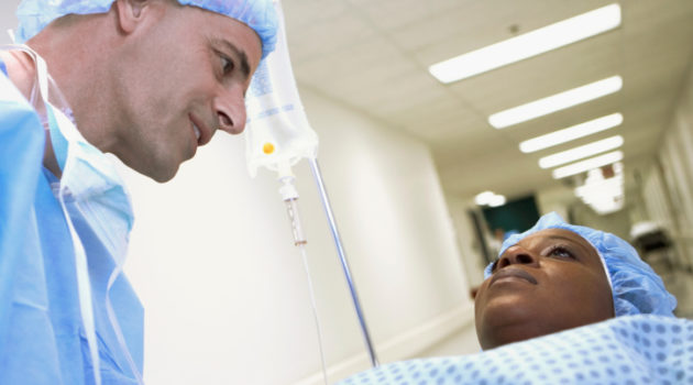 surgeion talking to African American woman in hospital