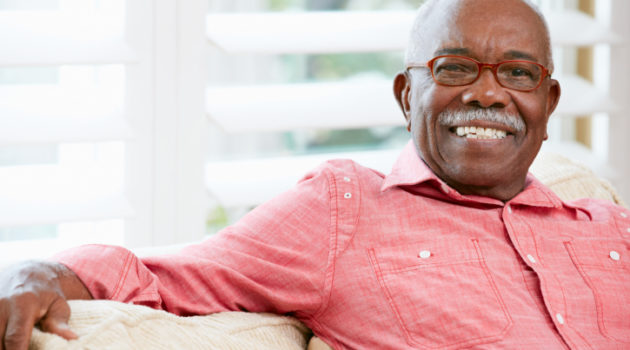 African American senior man smiling wearing glasses