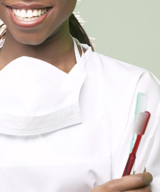 African American dentist with toothbrush