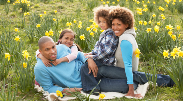 African American family out in park.