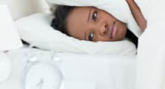 African American woman in bed