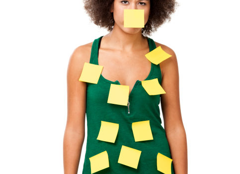 African American woman forgetful Post It Notes all over