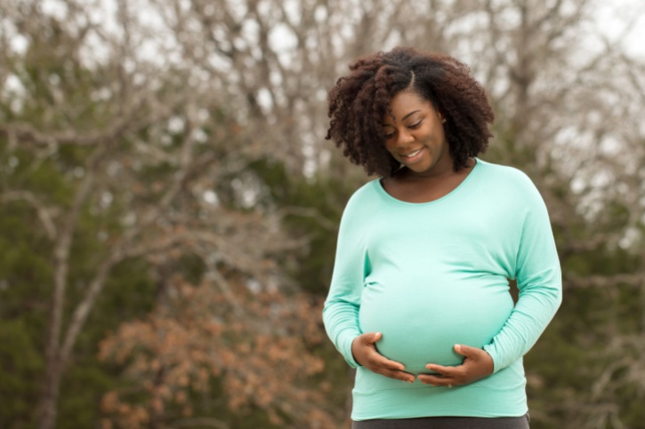 African American pregnant woman outside
