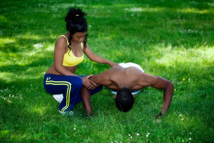 Black couple exercising outside