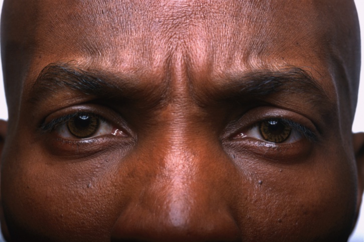 close up African American man's eyes
