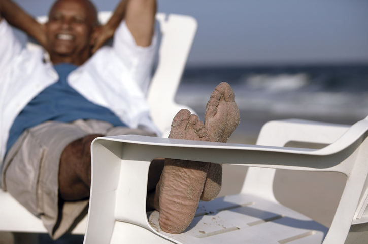 African American man relaxing on beach