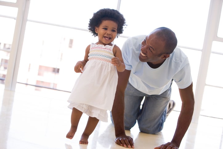 African American father and toddler daughter