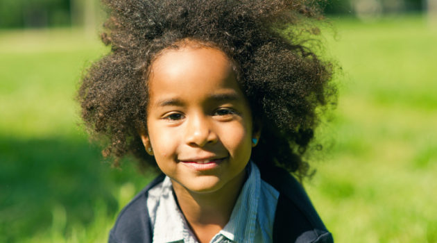 African American child with natural hair outside
