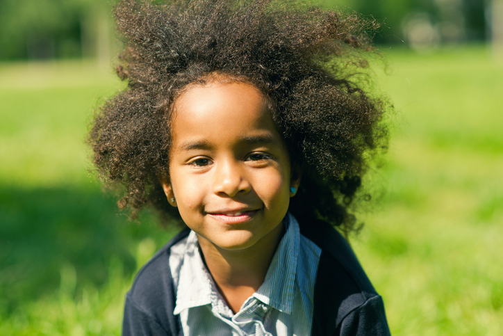 African American child with natural hair outside
