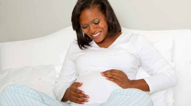 African American pregnant mom smiling