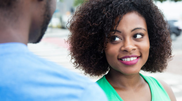 African American woman smiling flirting