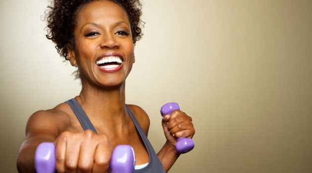 African American woman exercising with weights
