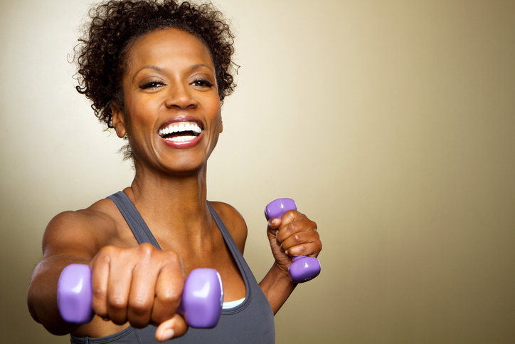 African American woman exercising with weights