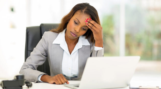 African American woman at work headache