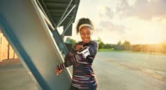 African American woman exercising outside