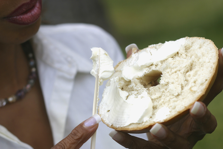 African american woman eating bagel