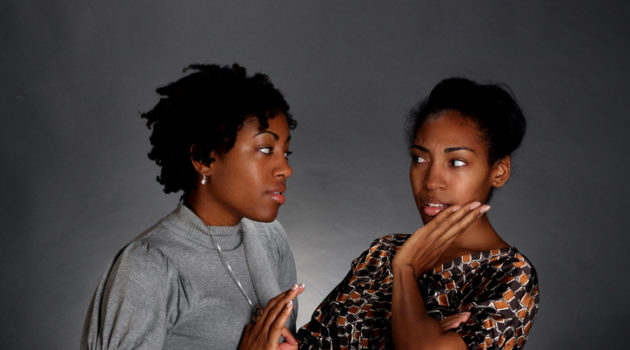 Two African American women natural hair talking
