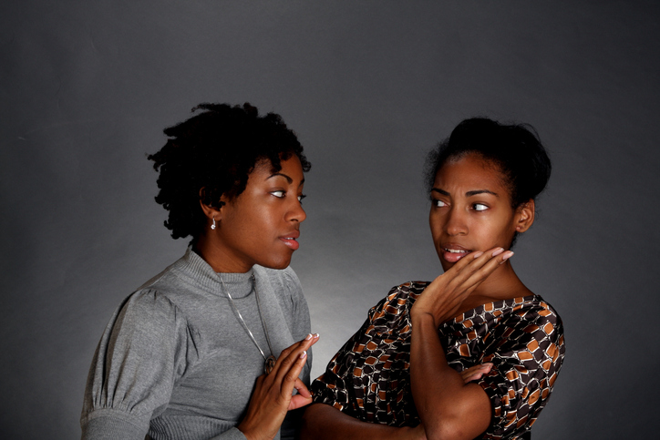 Two African American women natural hair talking