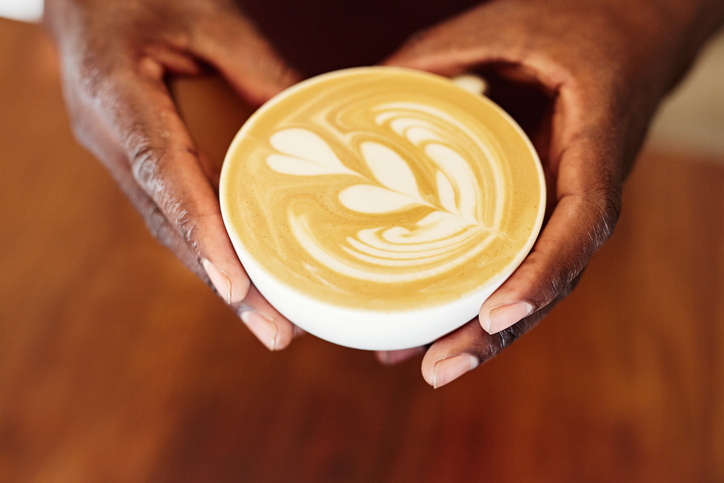 African American hands holding a coffee