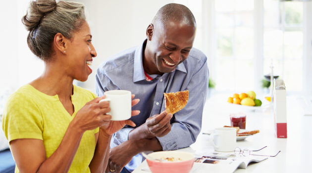 African American couple eating breakfast