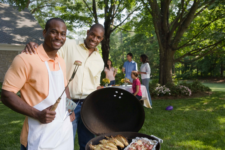 African American men grilling at BBQ