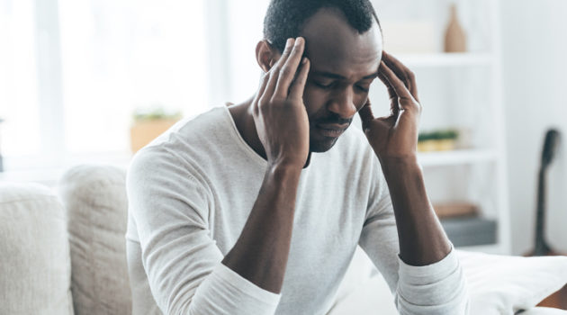African American man headache stressed