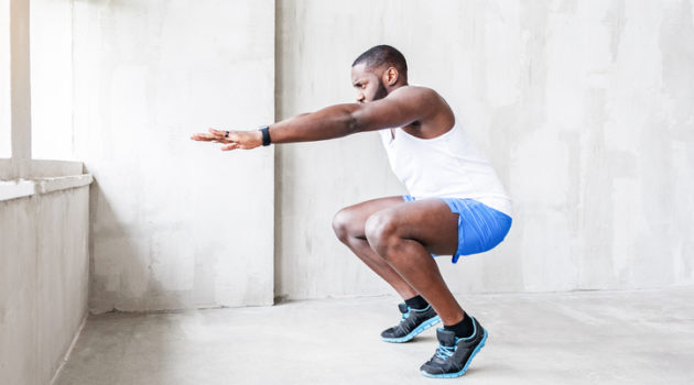 African American man exercise squat