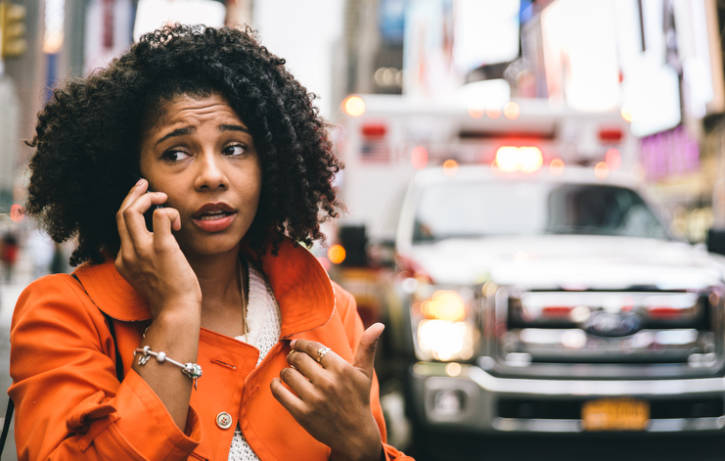African american woman calling 911 emergency