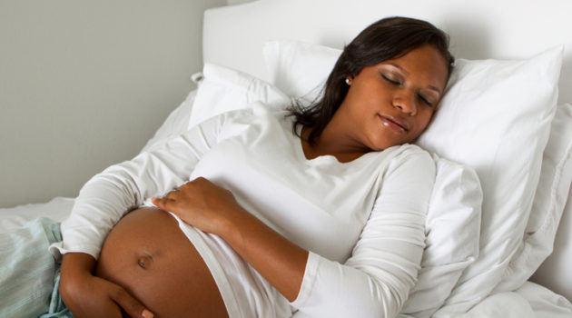 pregnant African American woman sleeping
