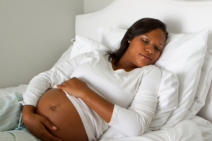 pregnant African American woman sleeping