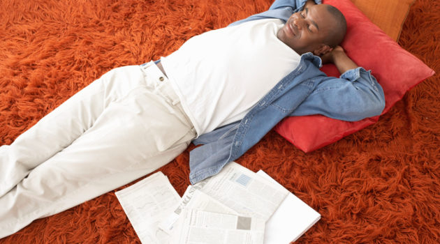 African American man laying down sleeping