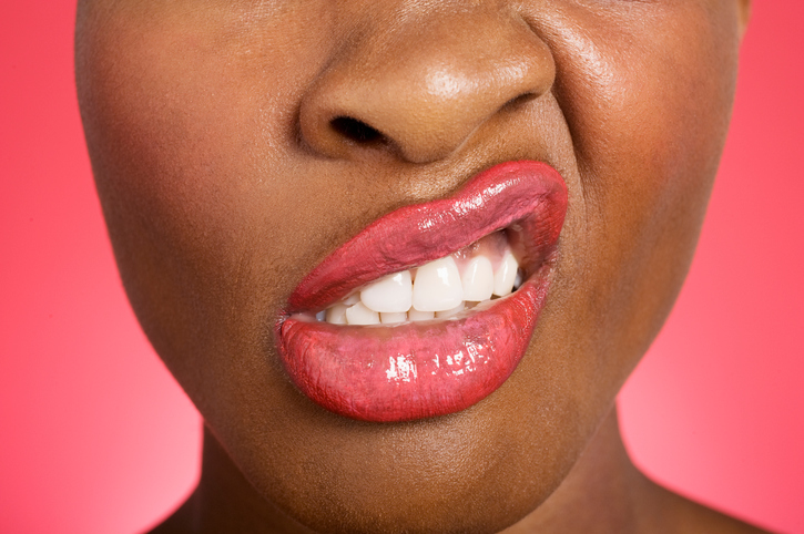 African American woman with lips twisted