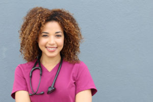 Black woman nurse with stethoscope. 