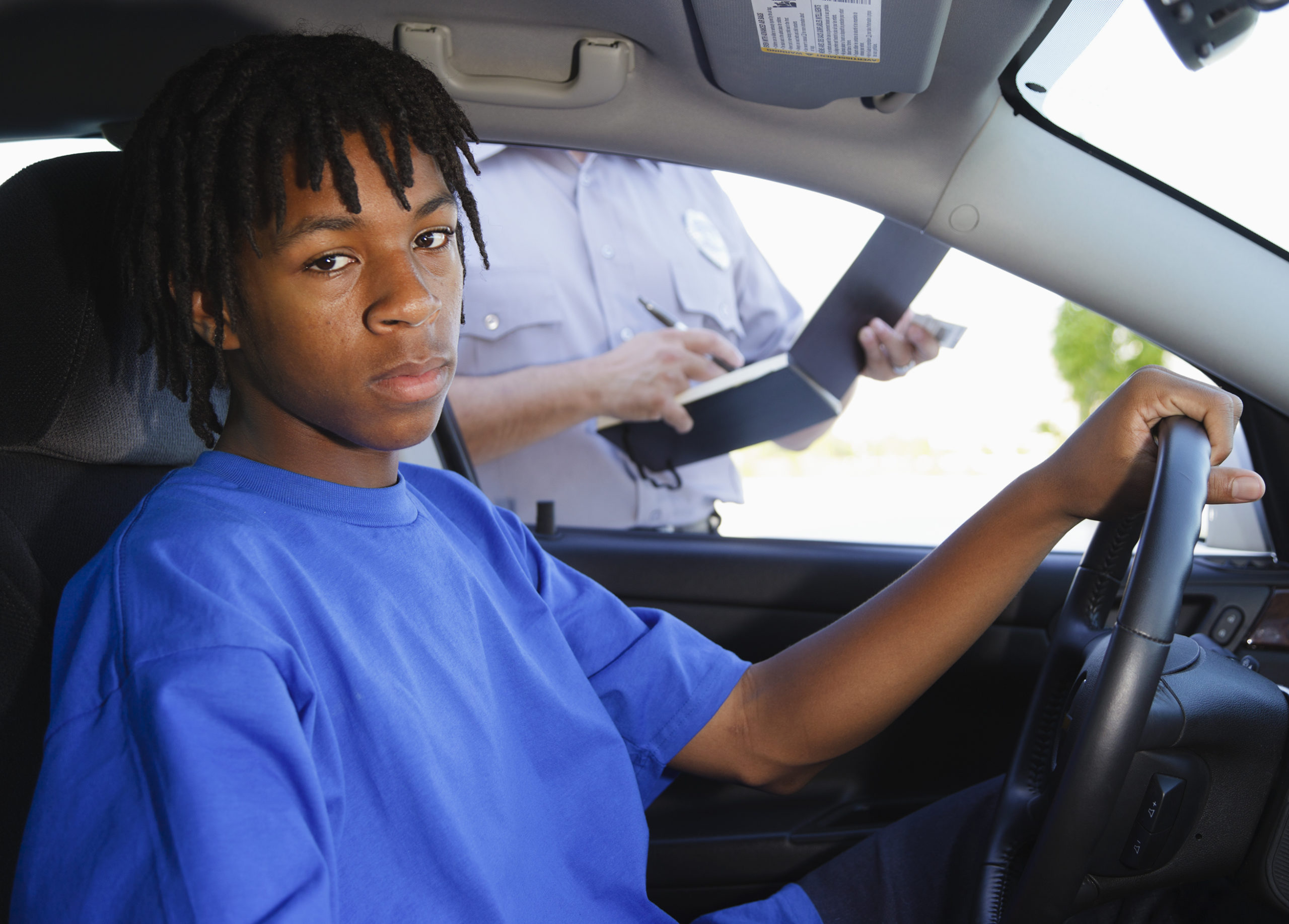 Teenage Boy Receiving a Ticket | BlackDoctor.org